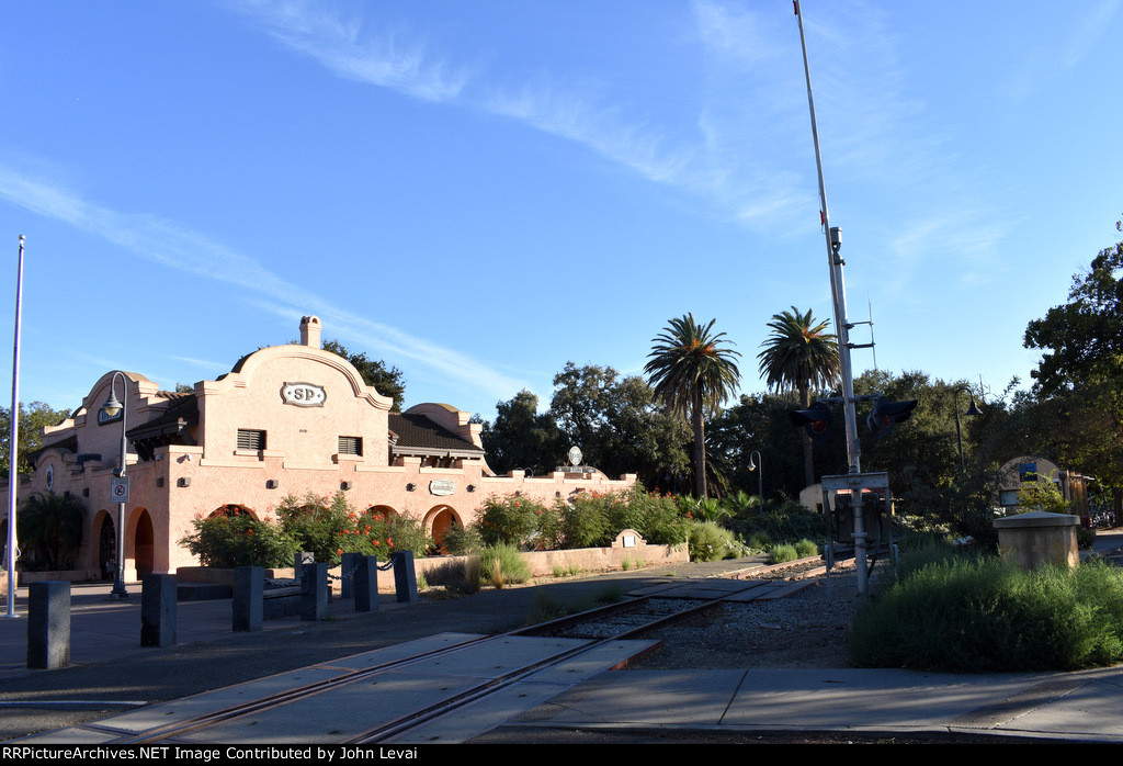 California Northern RR right of way in foreground with Amtrak Davis Station building in background